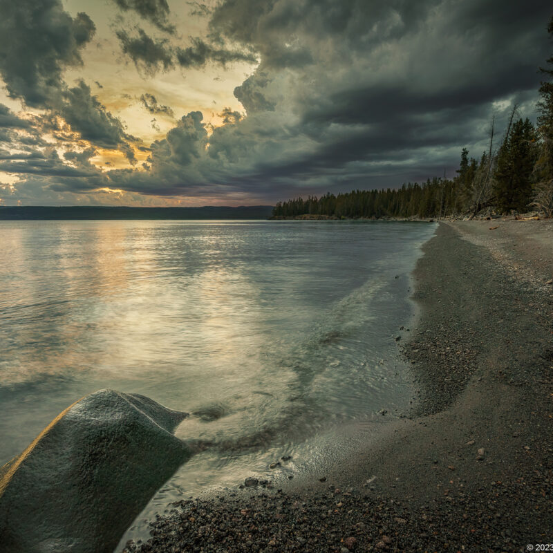 Image of a rocky shoreline at sunset