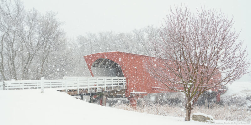Image of a covered bridge in the snow