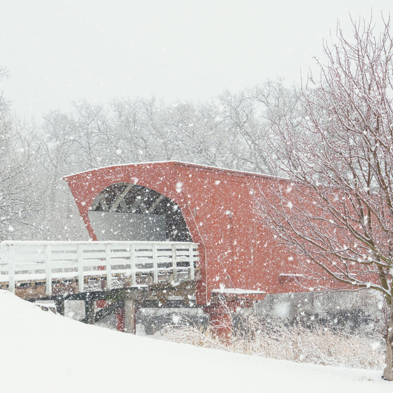 Image of a covered bridge in the snow
