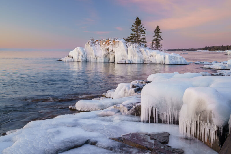 Image of a snow covered island at sunrise